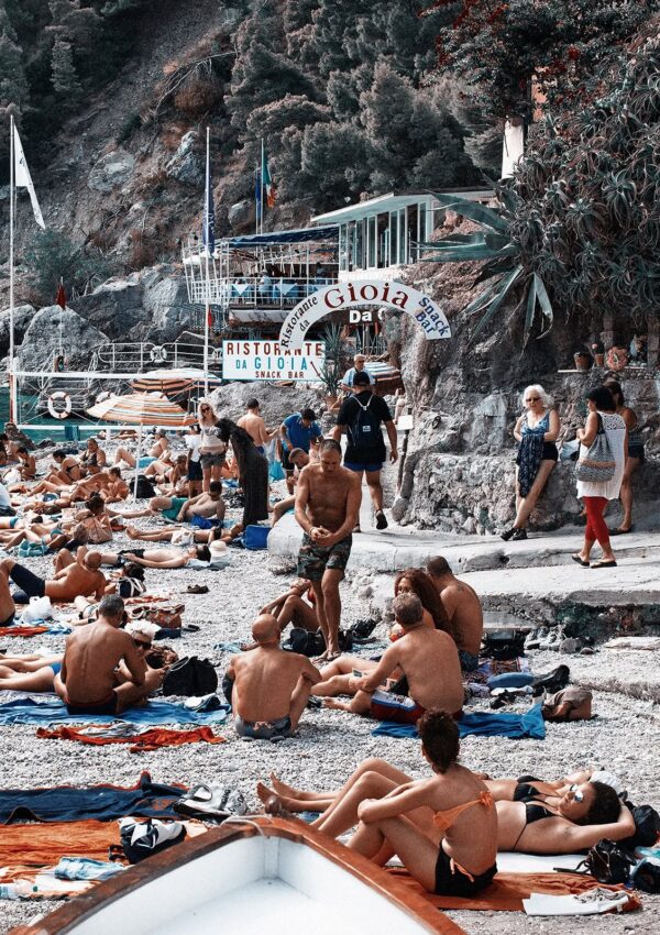 A photo of tourists relaxing in front of Gioia restaurant at Marina Piccola Beach in Capri, Italy