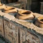 Pottery and ancient paintings in Pompeii at the ancient ruins.