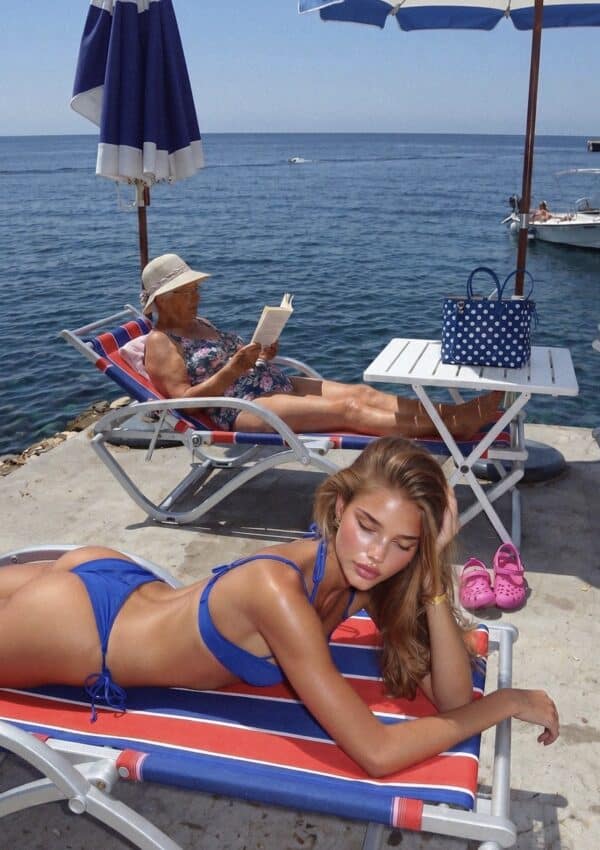 Victoria Van Der Berg napping on a sun lounger at Lido Capo di Conca on the Amalfi Coast, Italy