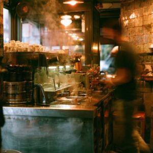Interior of a Naples espresso bar with steam and motion blur