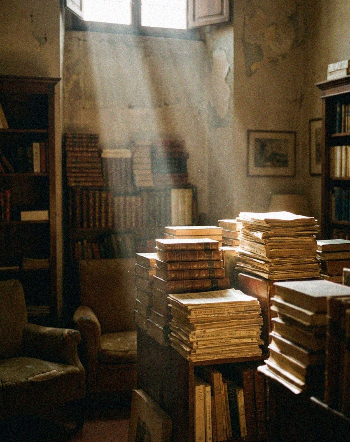 A dim Florentine antiquarian bookshop stacked with old books in shafts of light