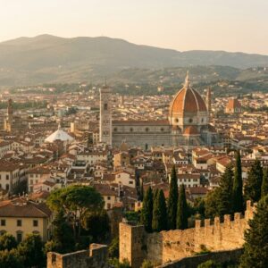 The Duomo of Florence and the city rooftops seen from the hills at golden hour
