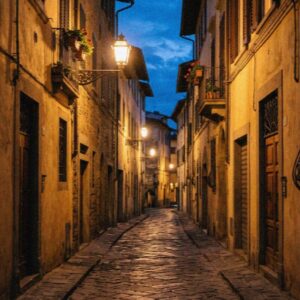 A lamplit cobblestone lane in Florence at blue hour