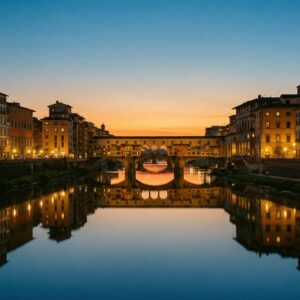 The Ponte Vecchio reflected in the Arno at dusk in Florence