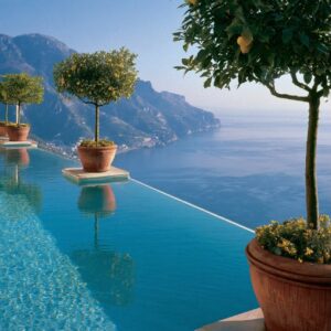 Hotel Caruso infinity pool with lemon trees in terracotta pots above the Amalfi Coast in Ravello