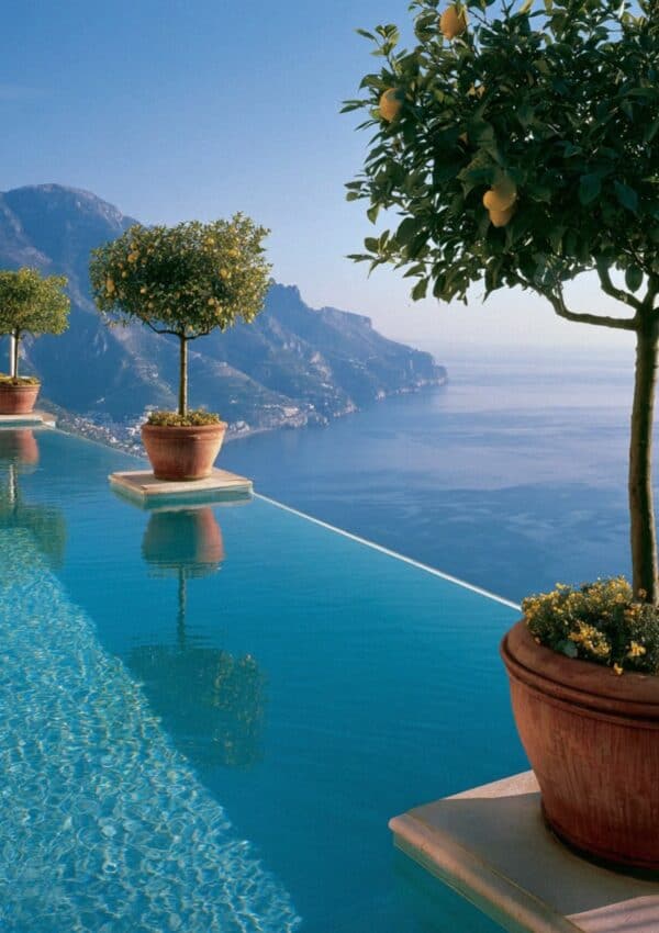 Hotel Caruso infinity pool with lemon trees in terracotta pots above the Amalfi Coast in Ravello