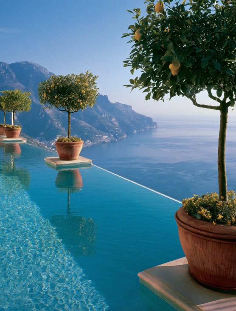 Hotel Caruso infinity pool with lemon trees in terracotta pots above the Amalfi Coast in Ravello