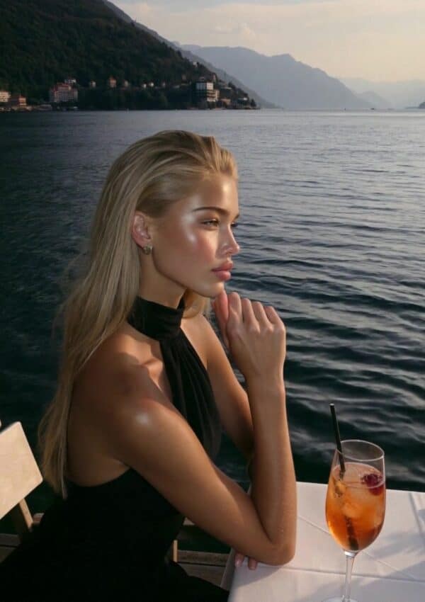 A lakeside aperitivo at golden hour on Lake Maggiore with the mountains beyond