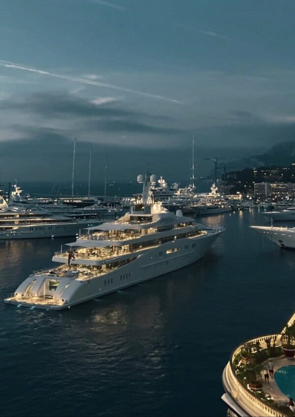 Victoria Van Der Berg on a yacht deck overlooking the Monaco Grand Prix
