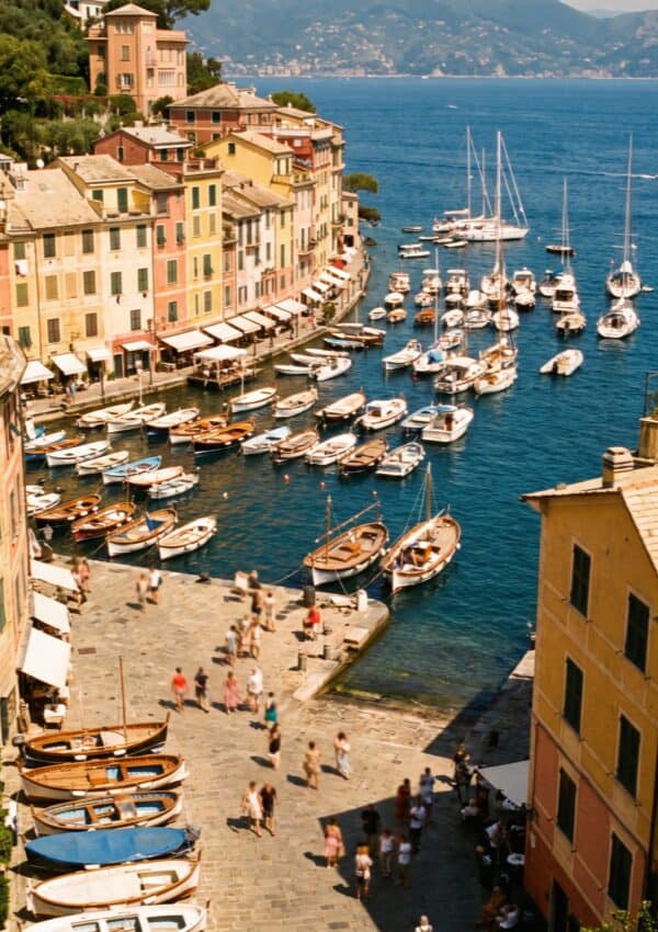 The Portofino harbour packed with boats and summer visitors at peak August midday