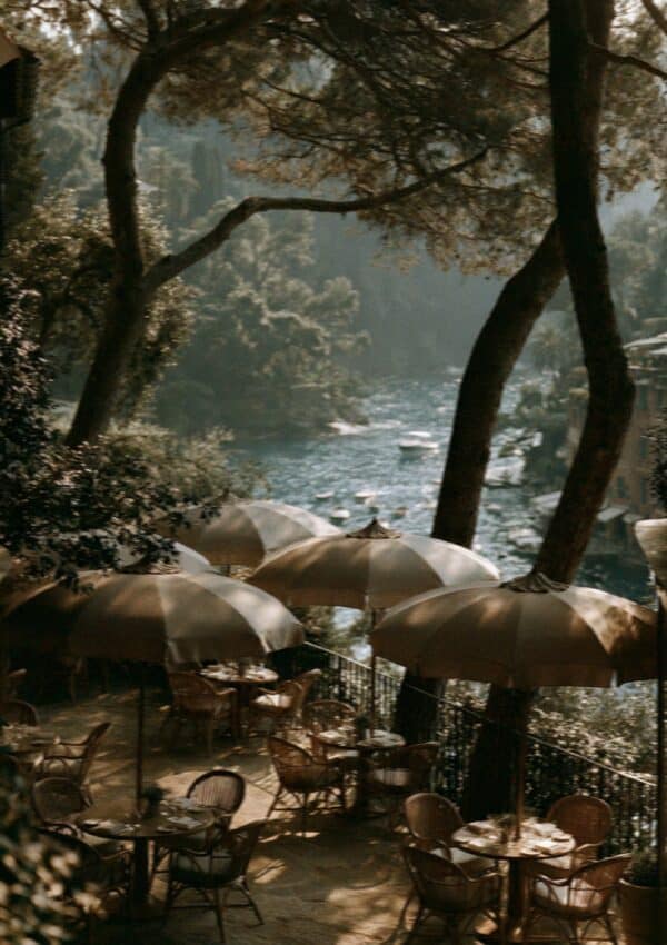 Striped umbrellas under the pines at Paraggi beach near Portofino