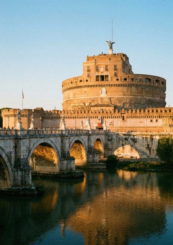 Castel Sant'Angelo and its bridge over the Tiber in Rome at golden hour