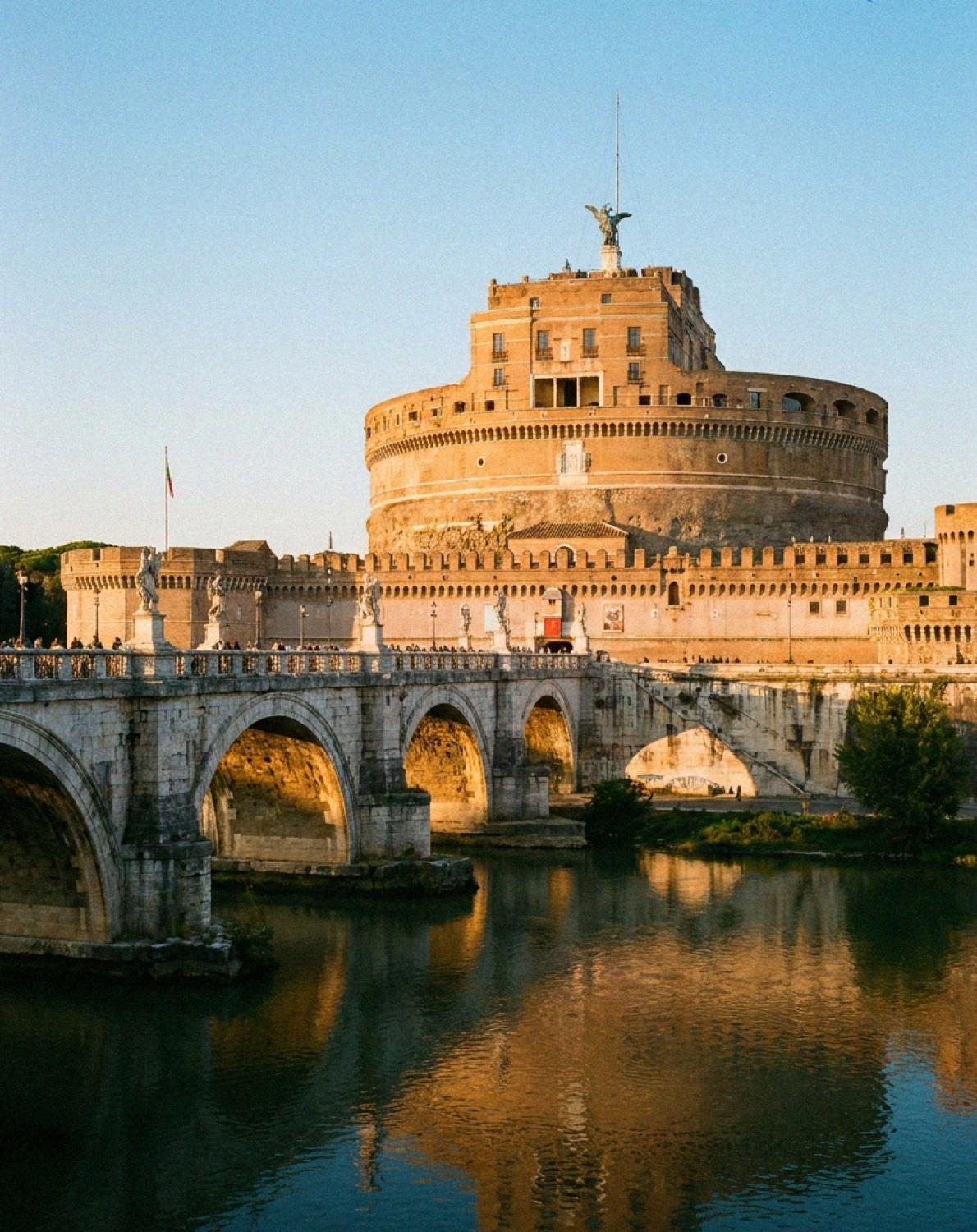 Castel Sant'Angelo and its bridge over the Tiber in Rome at golden hour