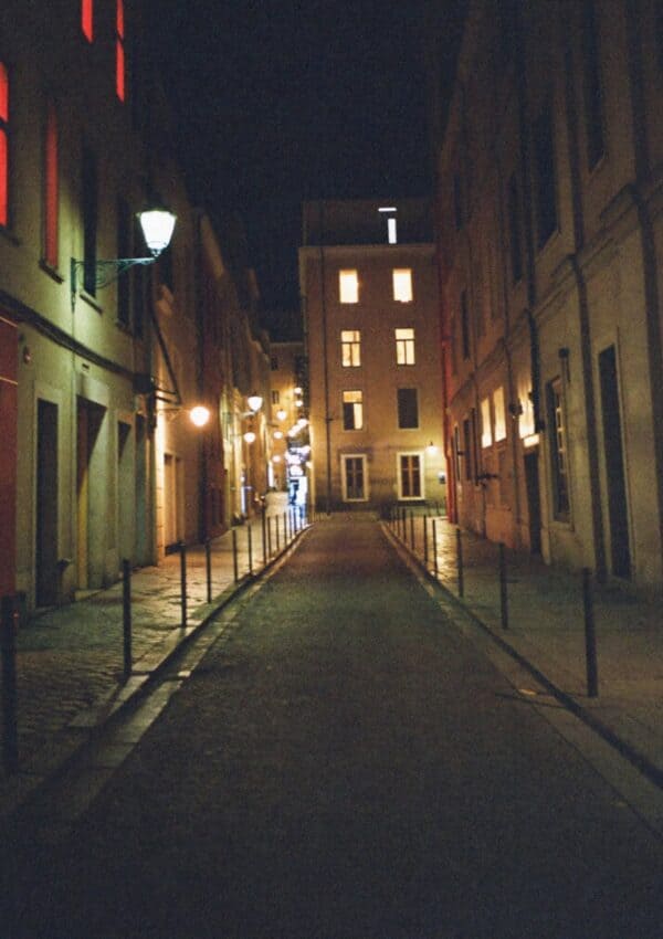 A quiet lamplit Rome lane at night