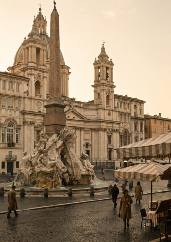 Piazza Navona in Rome in soft morning light with its baroque fountain and church facade