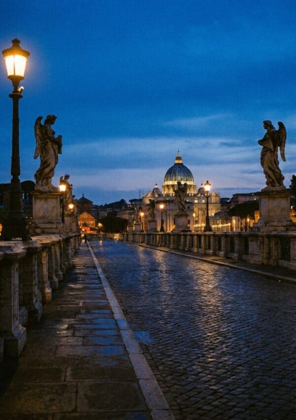 Ponte Sant'Angelo in Rome at blue hour, the marble angels leading toward the lit dome of St Peter's