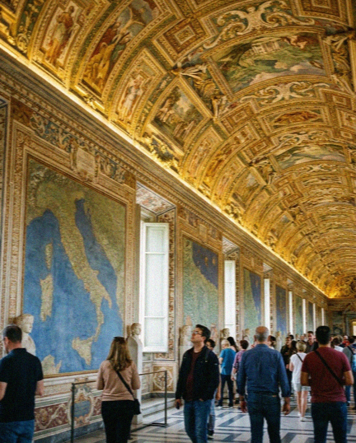 The Gallery of Maps in the Vatican Museums in Rome, painted maps along the walls beneath a gilded ceiling
