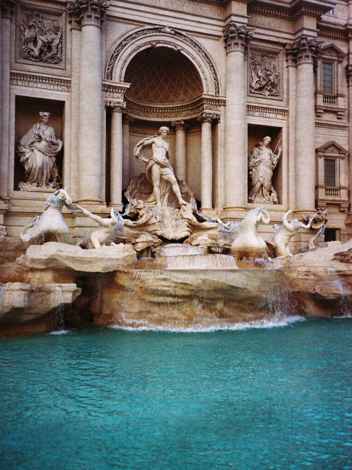 The Trevi Fountain in Rome, with Oceanus and his tritons above the turquoise water