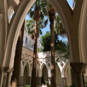 Victoria Van Der Berg beneath the Moorish arches of the Cloister of Paradise at the Duomo di Amalfi
