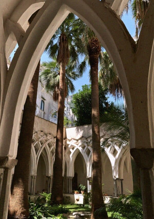 Victoria Van Der Berg beneath the Moorish arches of the Cloister of Paradise at the Duomo di Amalfi