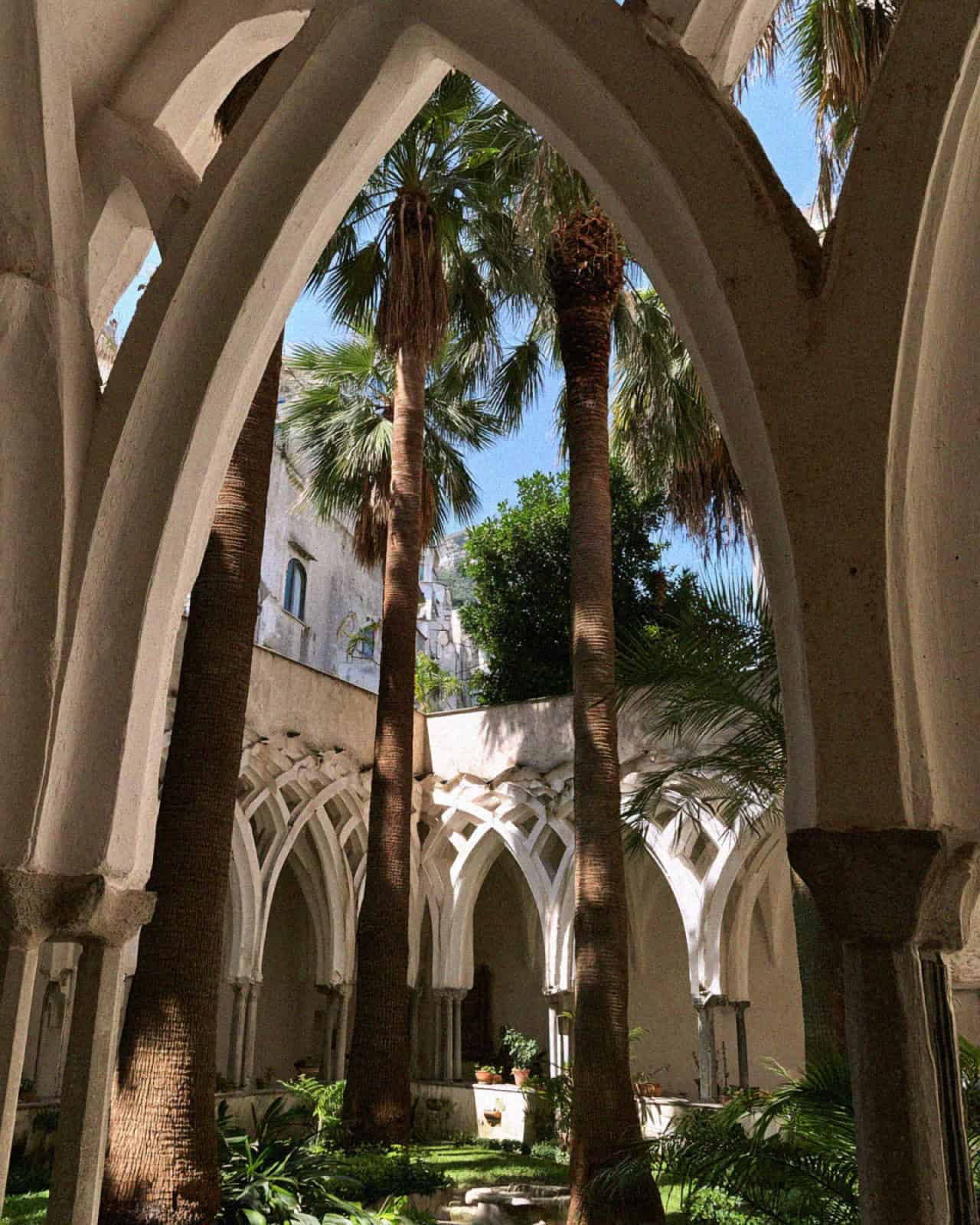 Victoria Van Der Berg beneath the Moorish arches of the Cloister of Paradise at the Duomo di Amalfi