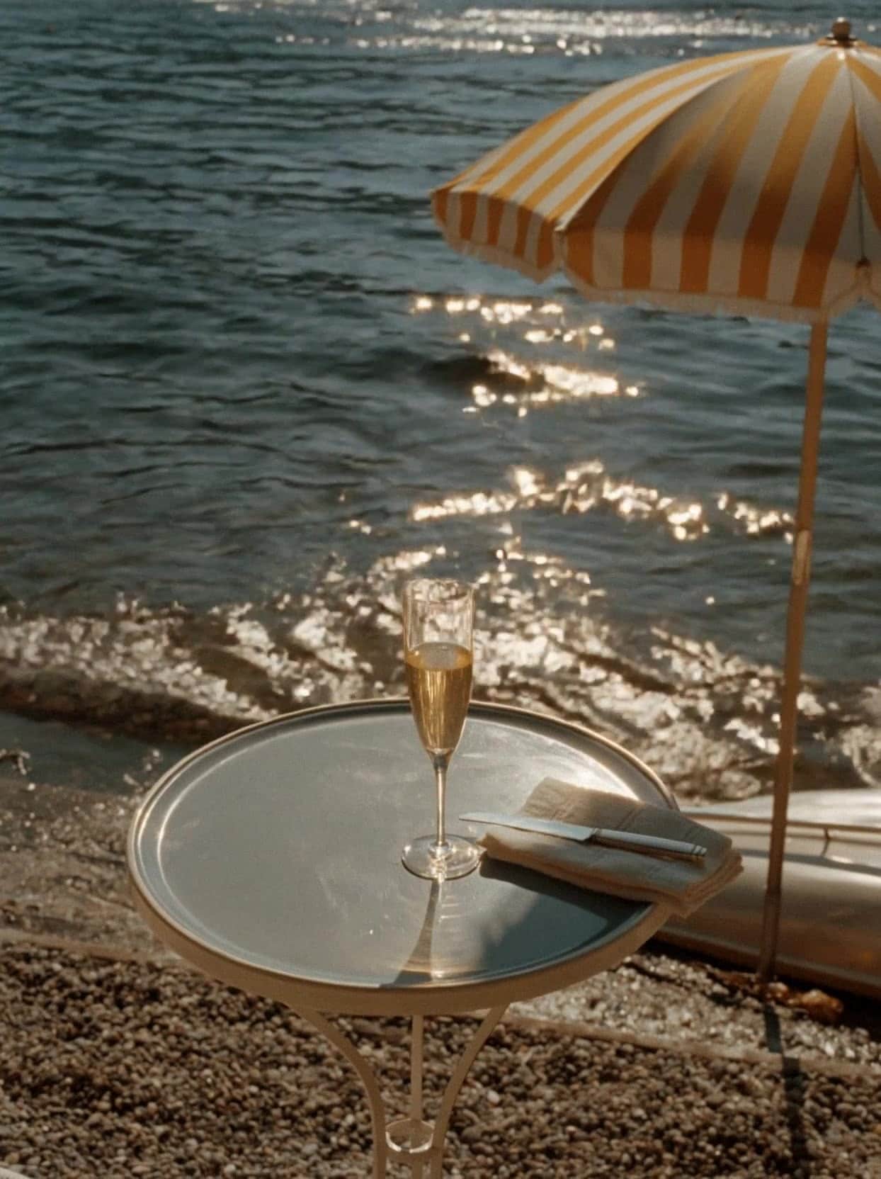 A glass of champagne beside Lake Como