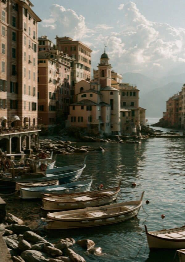 The tall pastel houses and fishing boats along the Camogli waterfront near Portofino