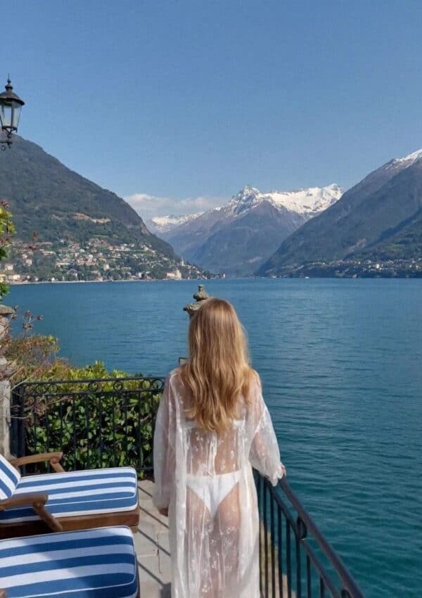 Victoria Van Der Berg on a lakeside terrace looking north to the mountains, Lake Como