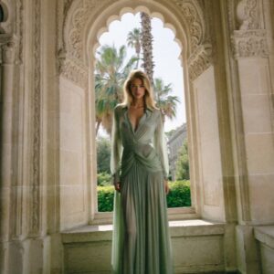 Victoria Van Der Berg in a gown framed by a Moorish arch at a villa in Ravello