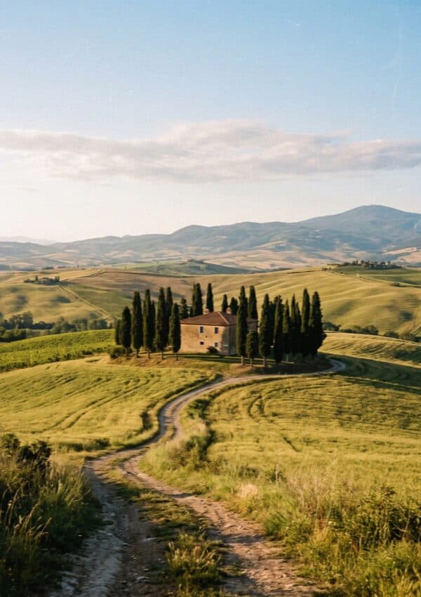 The classic Val d'Orcia view of a lone farmhouse and cypresses in Tuscany