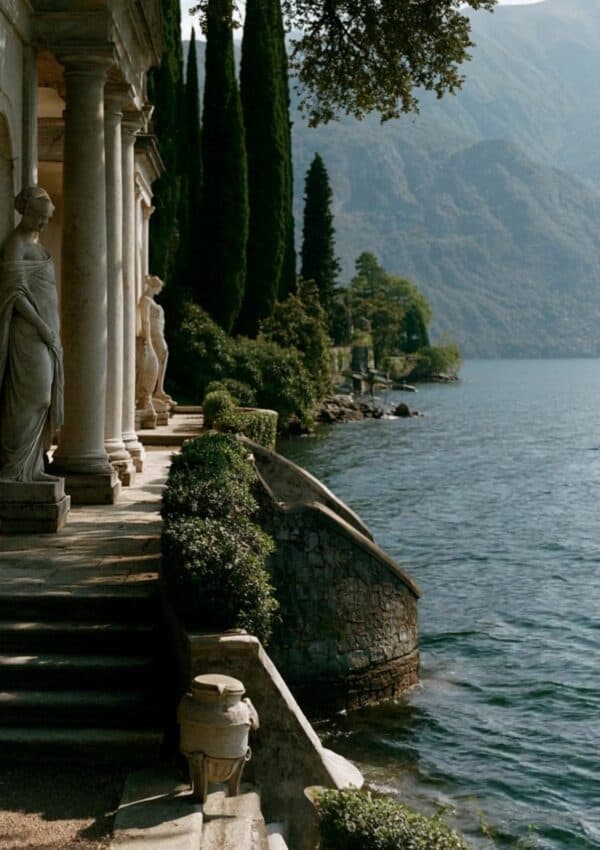A villa loggia and steps to the water, Lake Como