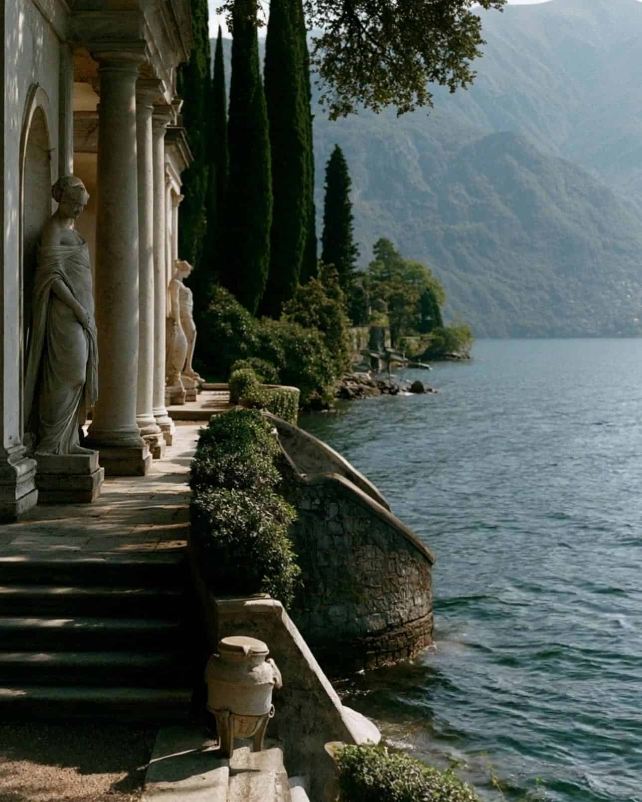 A villa loggia and steps to the water, Lake Como