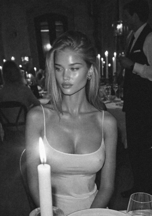Victoria van der Berg at a candlelit Florentine dinner in black and white