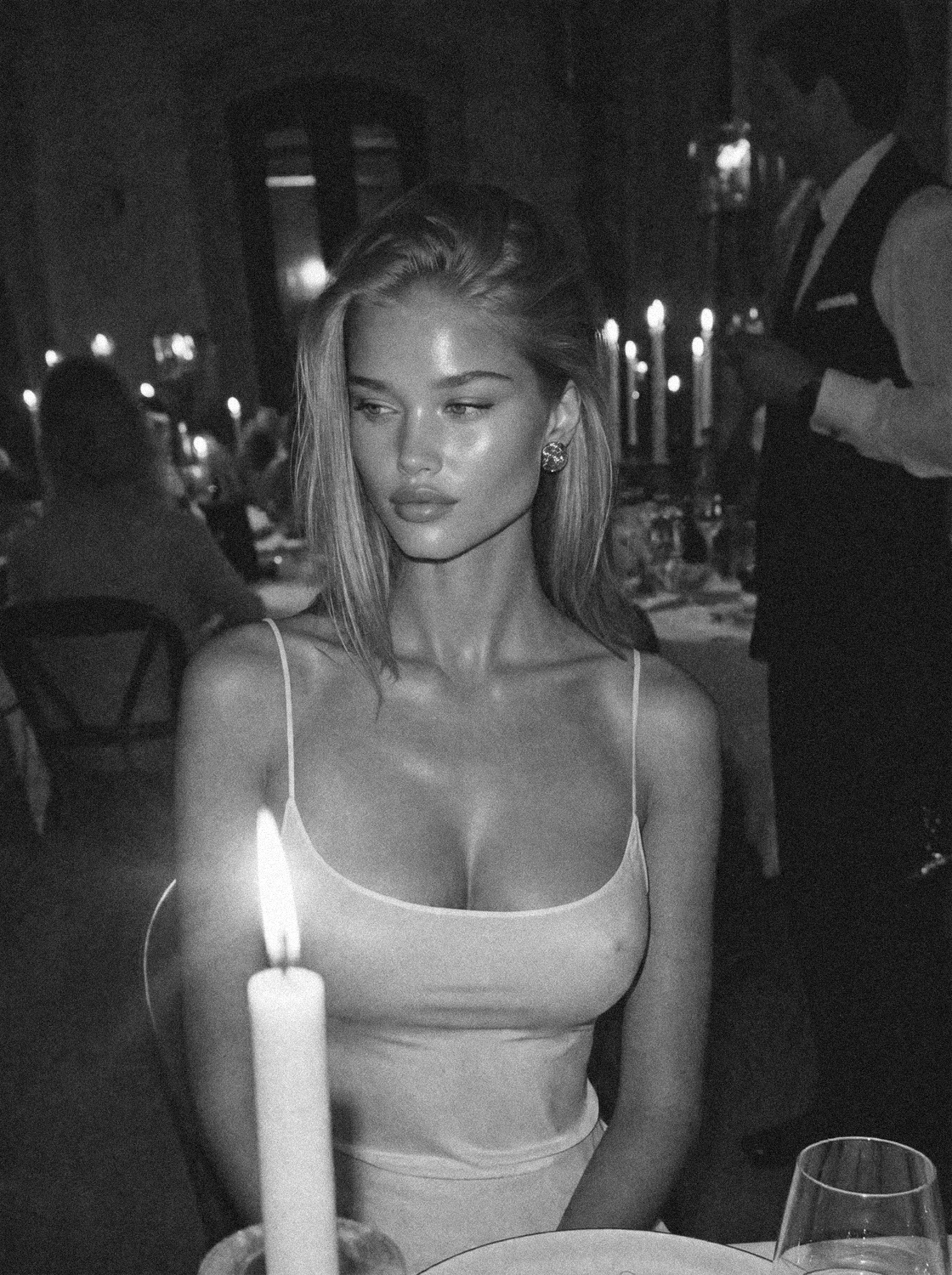 Victoria Van Der Berg at a candlelit Florentine dinner in black and white