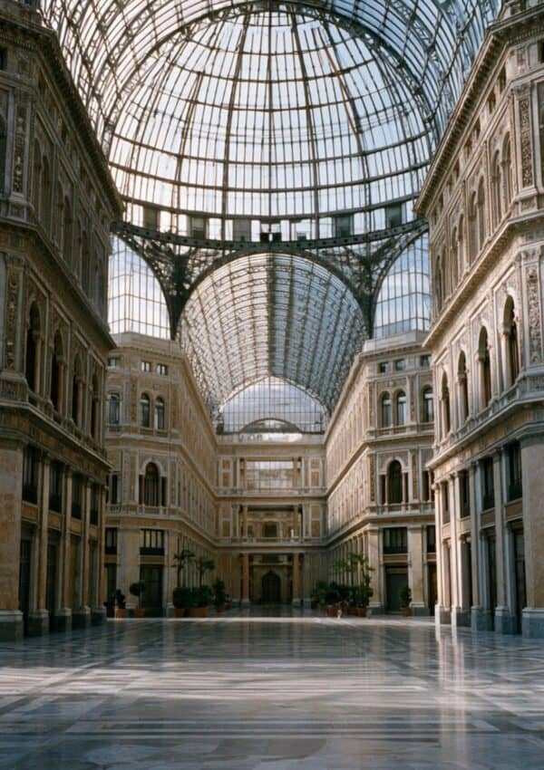 The vast iron and glass dome of Galleria Umberto I in Naples, almost empty in the morning light