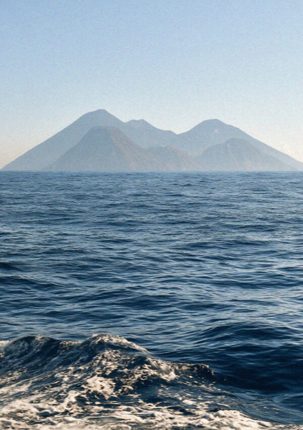 The volcanic cones of the Aeolian Islands seen from the sea in Sicily