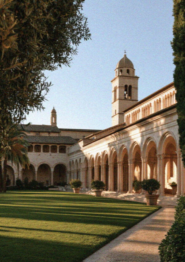The arcaded Piazza Inferiore before the Lower Church of San Francesco in Assisi