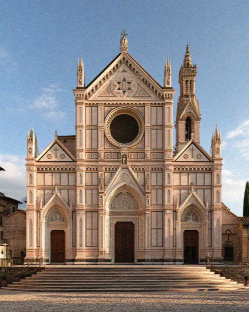 The facade of the Upper Basilica of San Francesco in Assisi with its Gothic rose window
