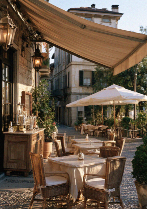 A cafe terrace with umbrellas in a Bergamo lane