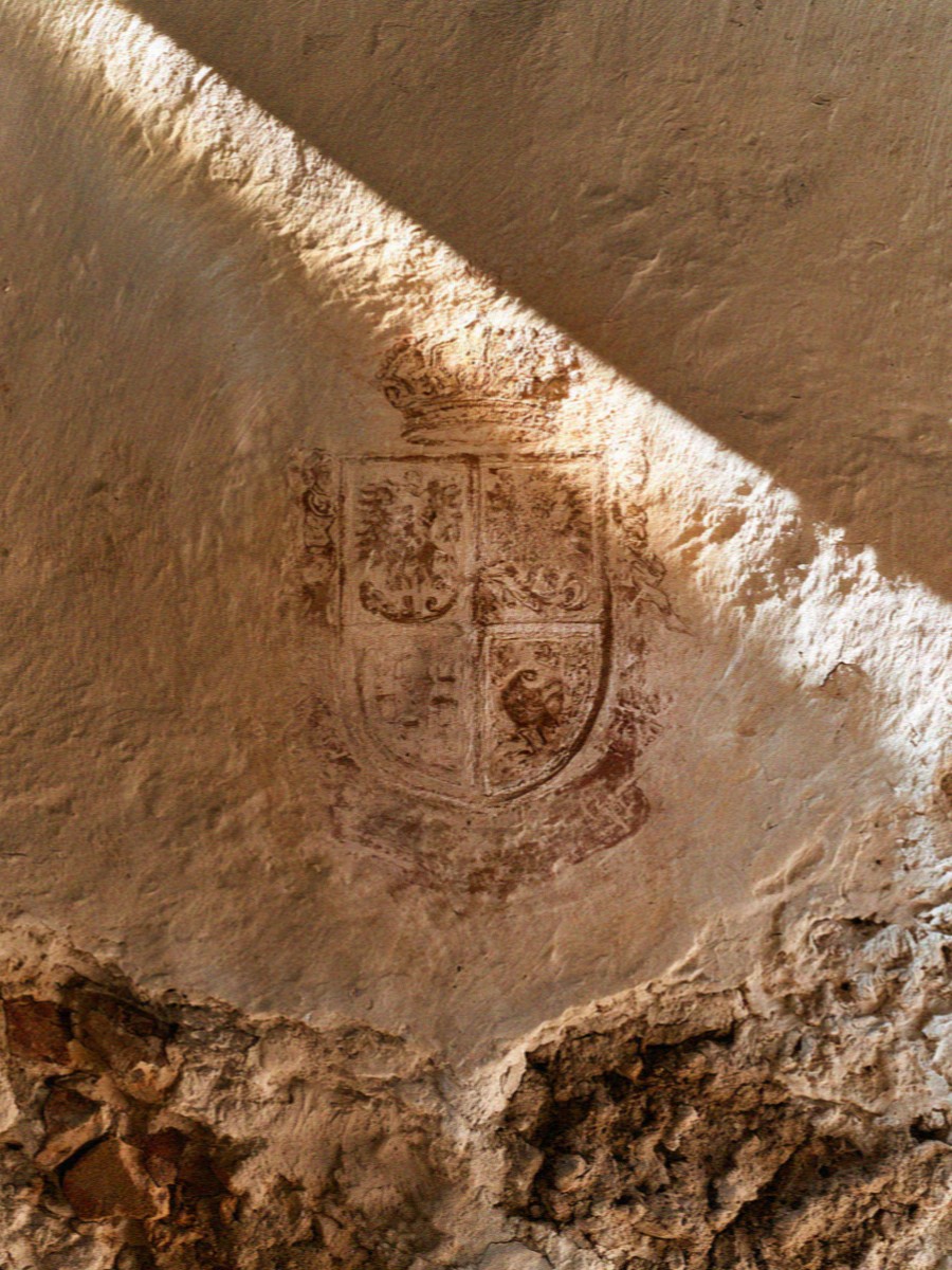 A painted heraldic crest on a vaulted wall of the old university in Bologna