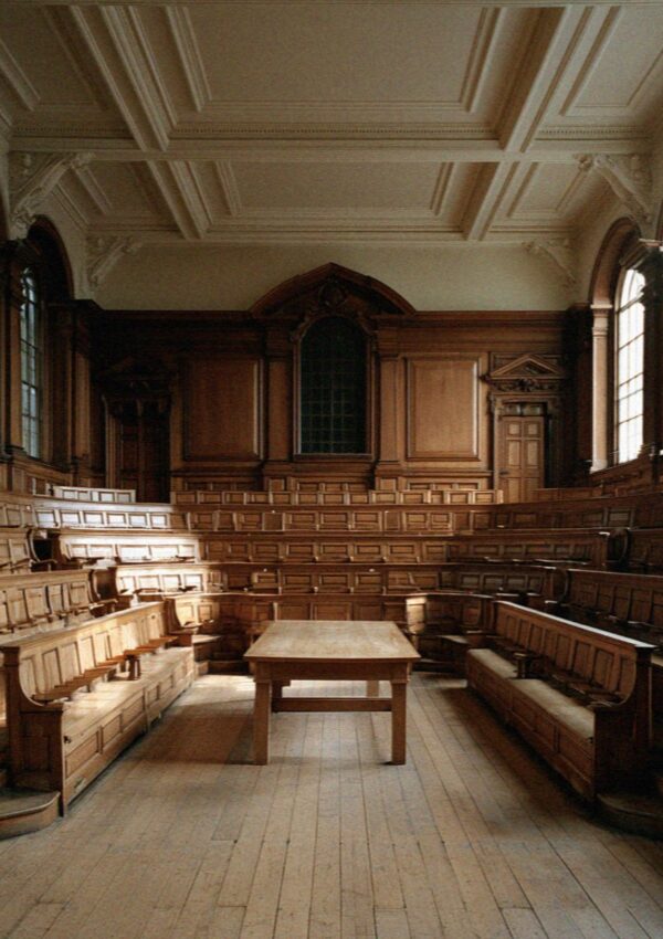 An old carved wooden lecture theatre with tiered benches in Bologna