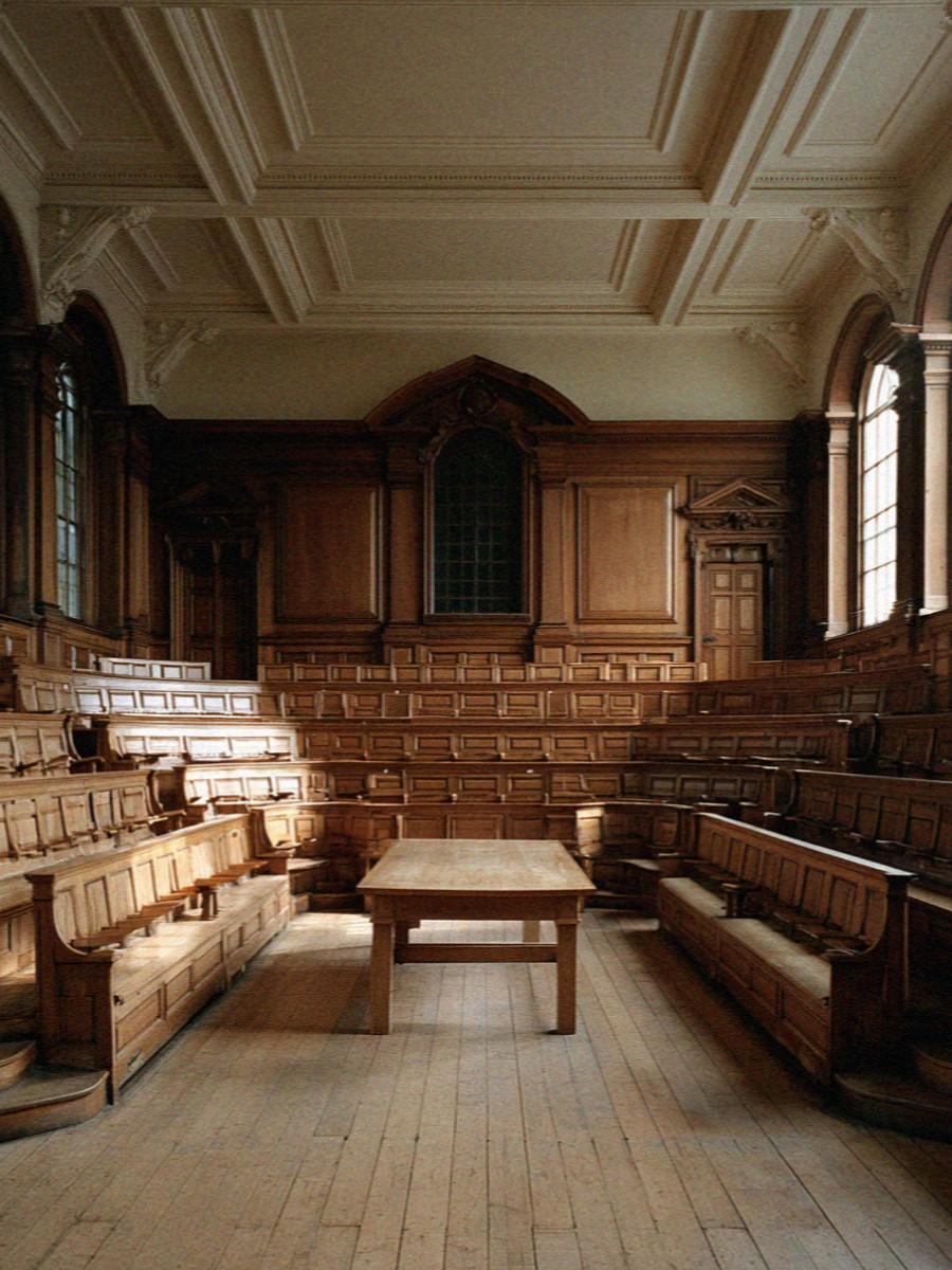 An old carved wooden lecture theatre with tiered benches in Bologna