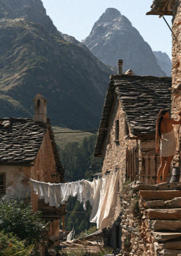 Old stone alpine houses with washing lines in the Dolomites