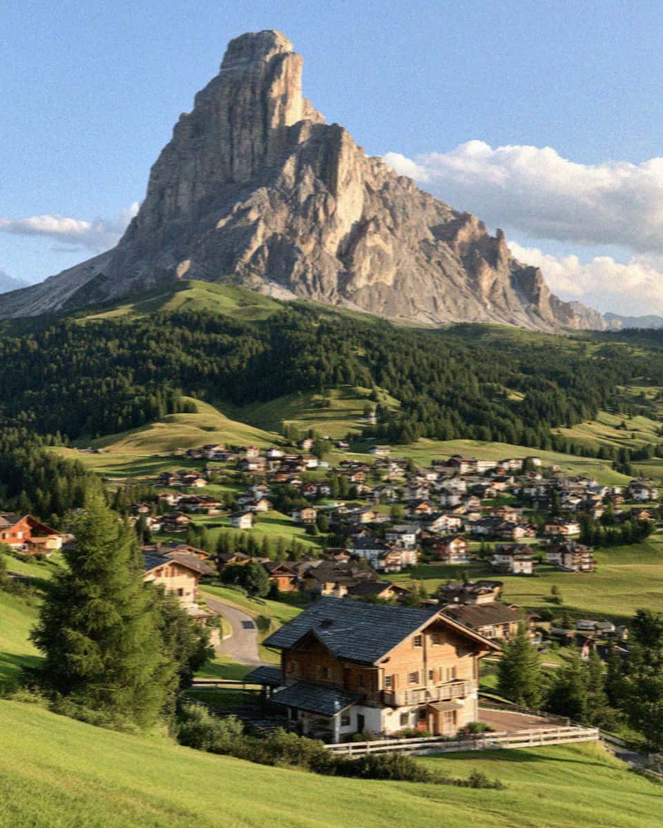 The village of Corvara beneath the Sassongher peak in Alta Badia, Dolomites