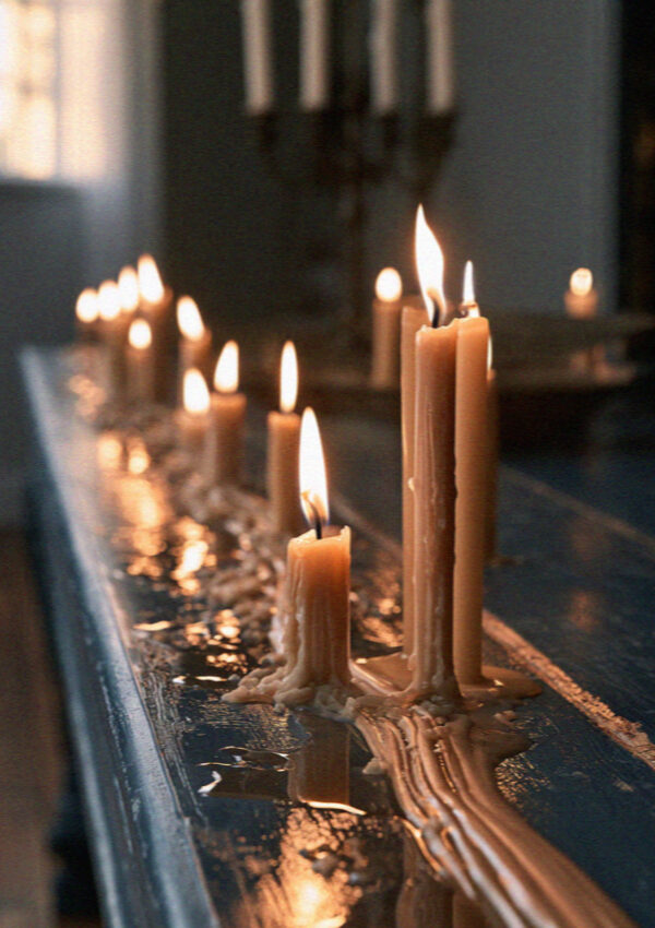 Candles on a maso windowsill at dusk in the Dolomites
