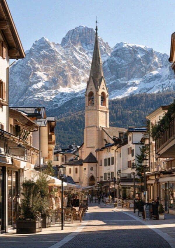 The pedestrian Corso Italia and church tower in Cortina d'Ampezzo, Dolomites