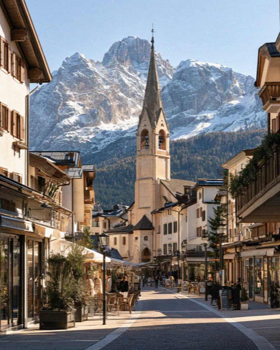 The pedestrian Corso Italia and church tower in Cortina d'Ampezzo, Dolomites