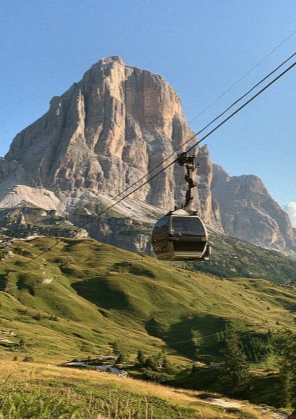 A cable car climbing toward the Tofana above Cortina d'Ampezzo, Dolomites