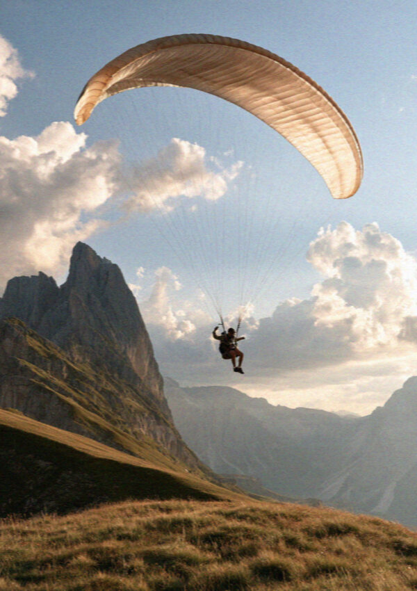 A paraglider launching over the peaks in the Dolomites