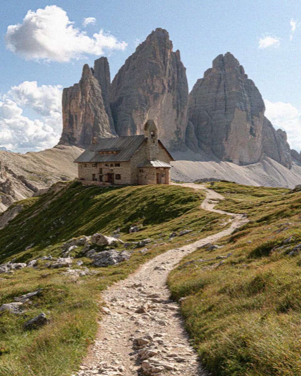 Rifugio Locatelli and its chapel below the three north faces of the Tre Cime di Lavaredo, Dolomites